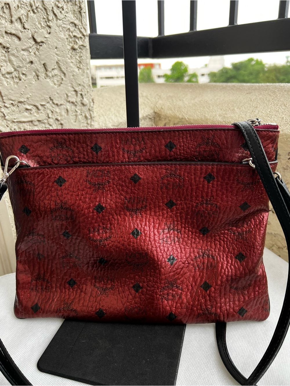 MCM Visetos Medium Crossbody Pouch in a metallic Scooter Red